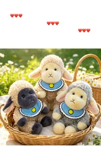 Close-up detail of three adorable curly wool sheep plush toys wearing blue bibs in a basket.