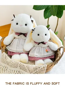 Macro view of two fluffy and soft white long-eared bunny plush dolls resting in a woven basket
