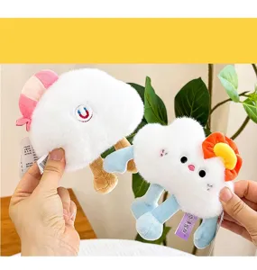 Close-up of cute cloud-shaped plush fridge magnets with colorful accessories.