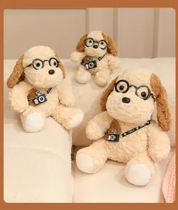 Cute custard plush puppy toy wearing black glasses and carrying a miniature camera accessory