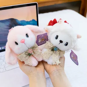 Adorable plush animal pendants featuring a pink bunny and a white lamb with lace bows