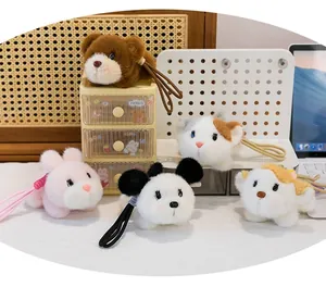Group of cute colorful plush animal backpack pendants and keychains on a desk organizer.
