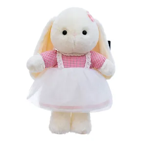 Adorable soft plush long-eared bunny toy wearing a pink checkered dress