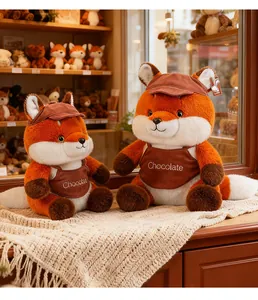 Close-up of Maillard style fox plush toys wearing brown aprons with Chocolate text