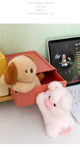 Detailed view of cute plush dog and pig doll desk companions with soft fur texture.