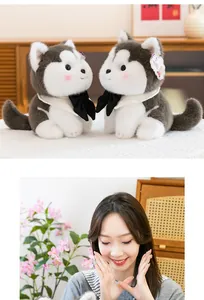 Close-up of adorable plush husky toys with scarves and soft texture showcase with model