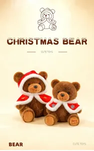 Detail of two brown Christmas teddy bears wearing festive red and white snowflake capes