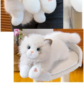 Realistic white ragdoll cat plush toy with blue eyes lying on a scratching post