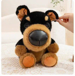 Close-up of a cute plush dog toy showing its soft texture and large black nose.