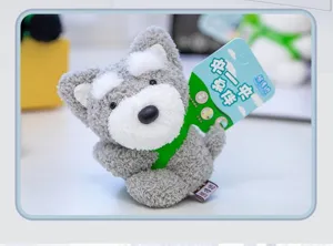 Close-up of a cute grey and white plush dog keychain pendant with soft fluffy fur texture