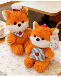 Close-up of cute fox plush toys showing high-quality fur texture and adorable accessories.