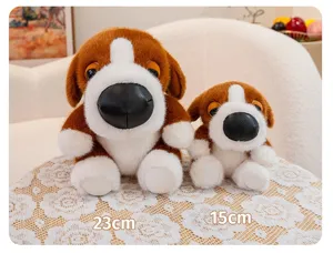 Detailed macro view of two cute brown and white big head dog plush toys, 15cm and 23cm