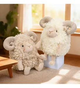 Detailed view of soft curly sheep plush toys in ivory and beige with ribbed horns.