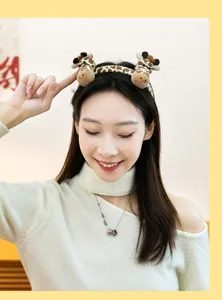 Cute plush giraffe headband hair accessory shown on an Asian female model for kids gift