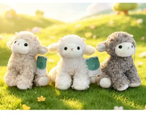 Detailed shot of three adorable curly fur lamb plush toys sitting on green grass