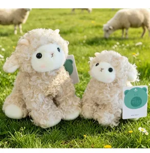 Macro view of two soft curly wool sheep plush toys on green grass field