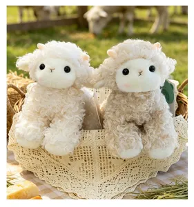 Close-up of two soft curly white lamb plush toys sitting in a rustic lace-lined basket