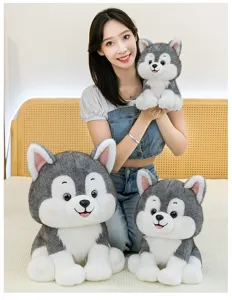 Three sizes of adorable grey and white husky dog plush toys shown in a bedroom setting