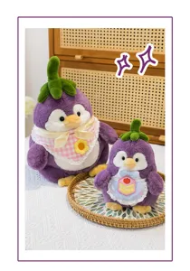 Detailed view of two cute purple eggplant penguin plush toys in a cozy home setting