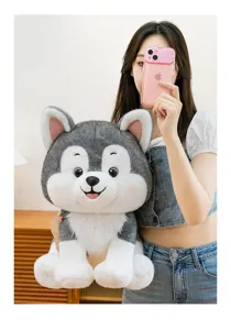 Adorable soft husky puppy plush toy held by a girl in a minimalist indoor setting