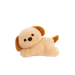 Cute lying puppy dog plush toy with soft fluffy fur on white background