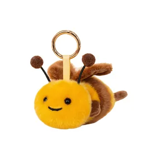 Adorable plush honeybee keychain with soft fuzzy texture and a golden metal hanging ring