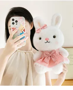 Detailed view of the cute white rabbit plush doll in a pink princess lace dress.