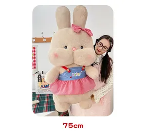 Macro detail of large 75cm plush rabbit doll wearing a cute pink checkered dress