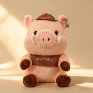 Cute Maillard pink pig plush toy wearing a brown chocolate bib and matching hat gift