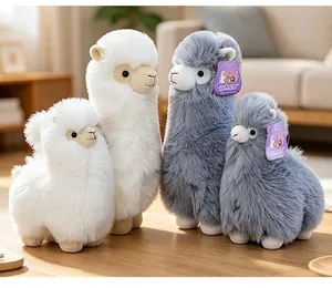 Detailed view of four soft snow velvet alpaca plush toys in white and gray with tags