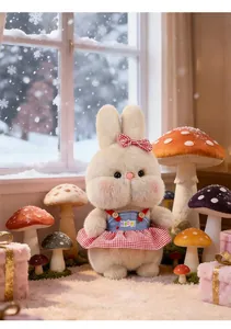 Close-up detail of a cute plush rabbit doll wearing a red checkered skirt and bow