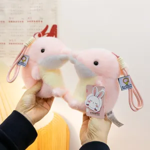 Two cute pink orca plush keychain charms with soft faux fur texture and hanging straps