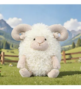 Adorable curly sheep plush toy with soft ram horns sitting on green grass in nature