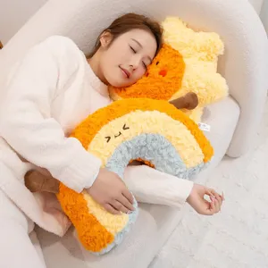 Soft plush rainbow and star shaped pillows held by girl for cozy home and bedroom decor