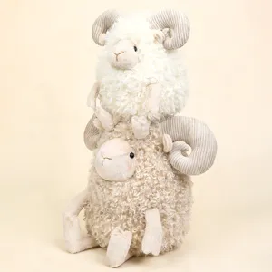 Set of two cute curly plush ram toys with striped horns in cream and beige colors