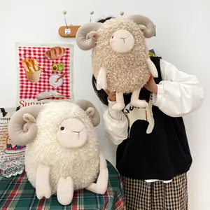 Cute curly wool sheep plush toys in white and beige presented in a cozy lifestyle setting.