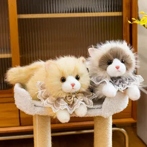 Pair of realistic ragdoll cat plush toys with cute lace scarves on a fluffy cat tree stand