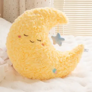 Cute yellow crescent moon plush pillow with a small blue star hanging decoration