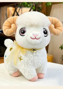 Cute fluffy ram plush toy detail, soft white fleece with golden bell ribbon and star embroidery.