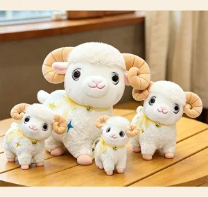 Detailed shot of cute simulation sheep plush toys with bells and star details for kids.