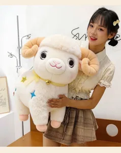 Cute plush sheep toy with bell and star embroidery, soft stuffed animal bed pillow for kids.