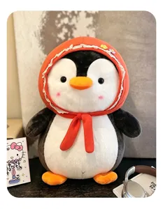 Nahaufnahme eines süßen Pinguin-Plüschtiers mit einer orangefarbenen Spitzenhaube