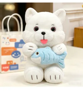 Detailed close-up of a cute white cat plush toy holding a small blue fish in its paws