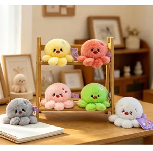 Assorted colorful plush octopus keychain pendants displayed on a mini wooden rack in a cozy room