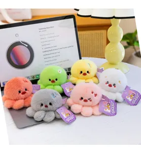 Colorful soft plush octopus keychain pendants in multiple colors displayed on a desk