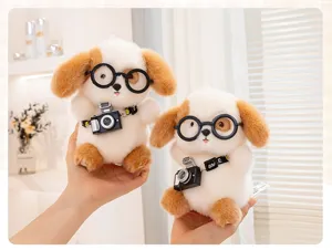 Close-up detail of two cute white and brown plush dog toys with glasses and cameras.