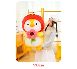Large cute penguin plush doll with strawberry hat holding pink flower 70cm detail view