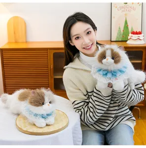 Realistic ragdoll cat plush toy with blue lace collar shown in a lifestyle setting.