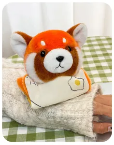 Detailed macro view of a cute red panda plush keychain with an egg toast bib accessory.