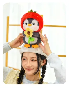 Cute penguin plush keychain with strawberry hat holding a yellow flower on a beret